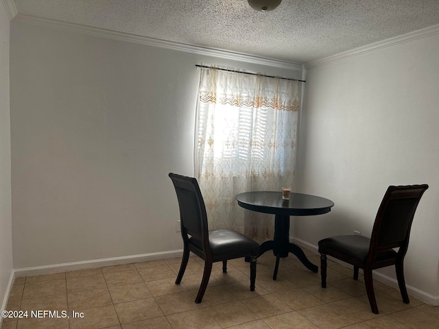 unfurnished dining area featuring crown molding, a textured ceiling, and light tile patterned floors