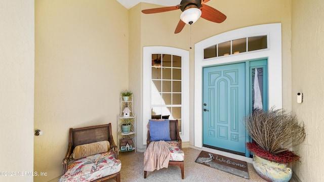 doorway to property with ceiling fan