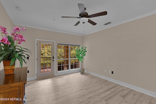 empty room with ornamental molding, light hardwood / wood-style floors, and ceiling fan