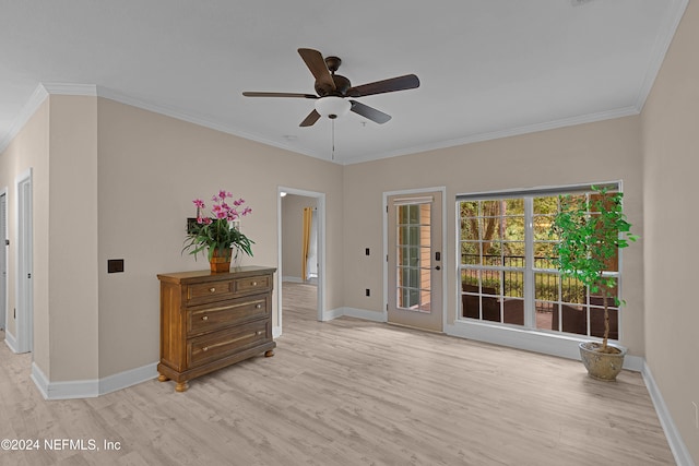 spare room featuring light hardwood / wood-style floors, ornamental molding, and ceiling fan