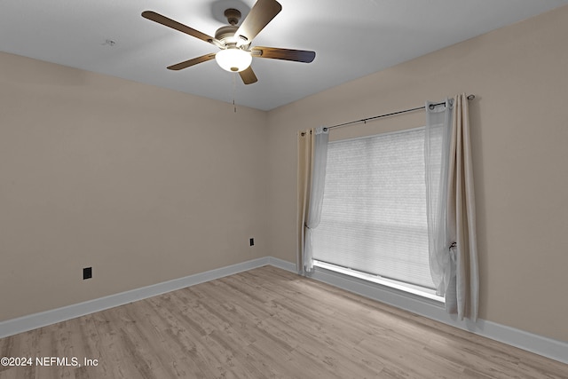 unfurnished room with ceiling fan and light hardwood / wood-style flooring