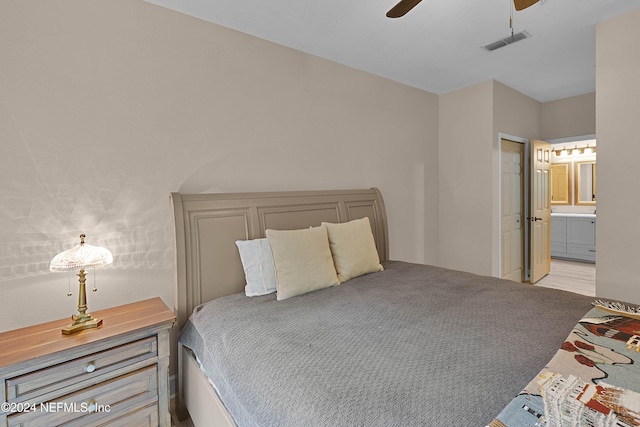 carpeted bedroom featuring ensuite bathroom and ceiling fan