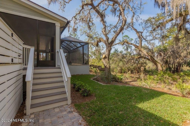 view of yard featuring a sunroom