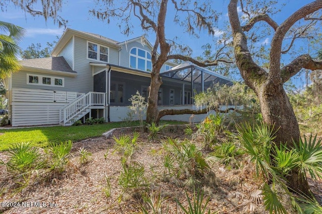 back of property featuring a sunroom