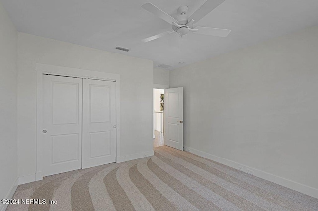 96613 Bay View Dr, Fernandina Beach, FL 32034 - unfurnished bedroom with light carpet, baseboards, and a closet
