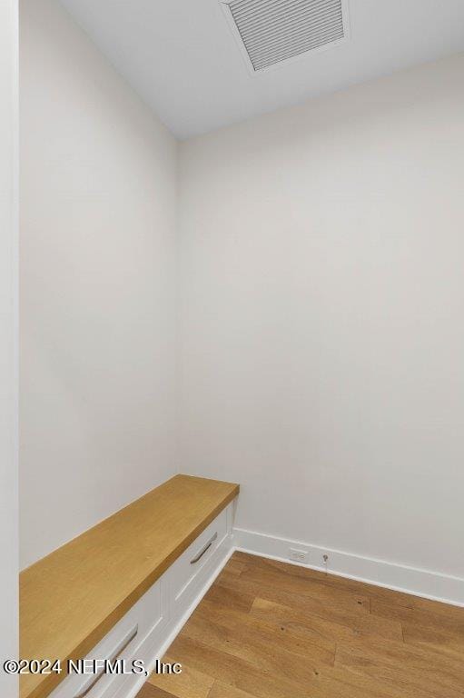 mudroom with light hardwood / wood-style floors