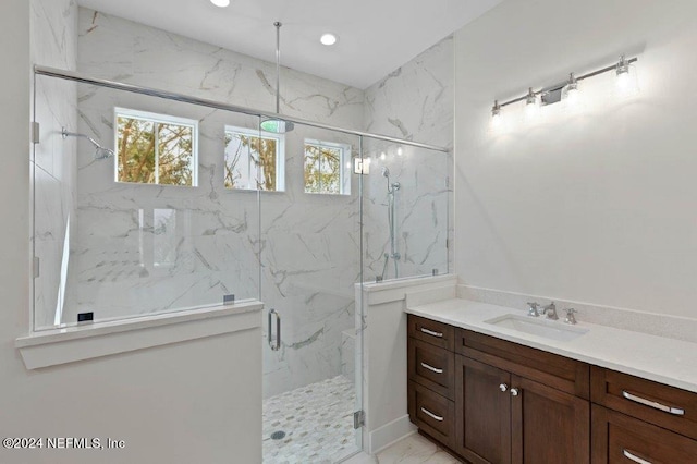96613 Bay View Dr, Fernandina Beach, FL 32034 - bathroom with a marble finish shower, vanity, plenty of natural light, marble look tile flooring, and recessed lighting
