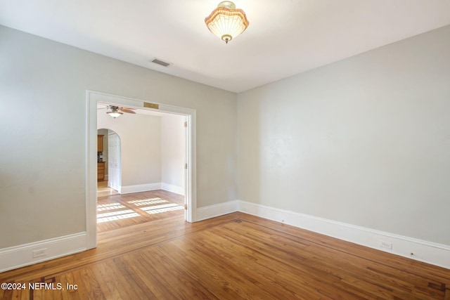 spare room with ceiling fan and hardwood / wood-style floors