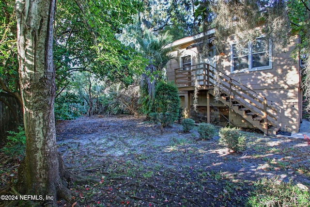 view of yard featuring a wooden deck