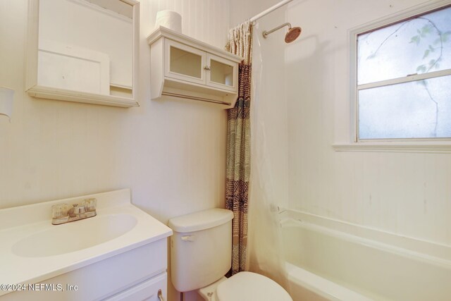 full bathroom featuring vanity, toilet, and shower / tub combo