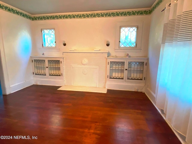 unfurnished living room featuring dark hardwood / wood-style floors