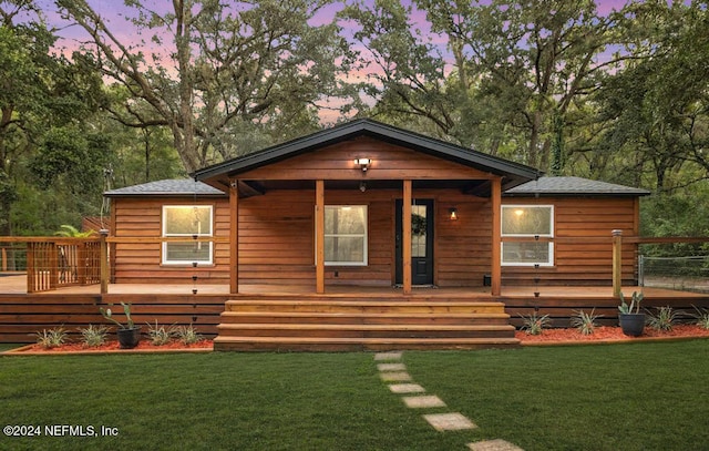 log home with a lawn