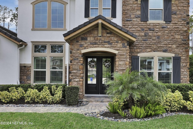 entrance to property featuring french doors