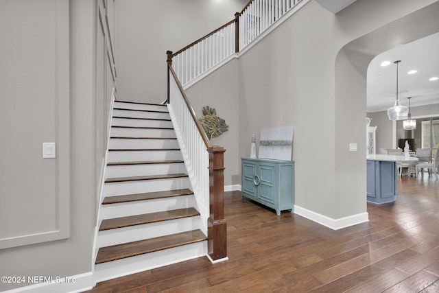 staircase featuring hardwood / wood-style floors