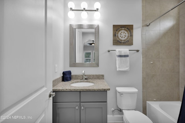 full bathroom featuring vanity, toilet, and tiled shower / bath