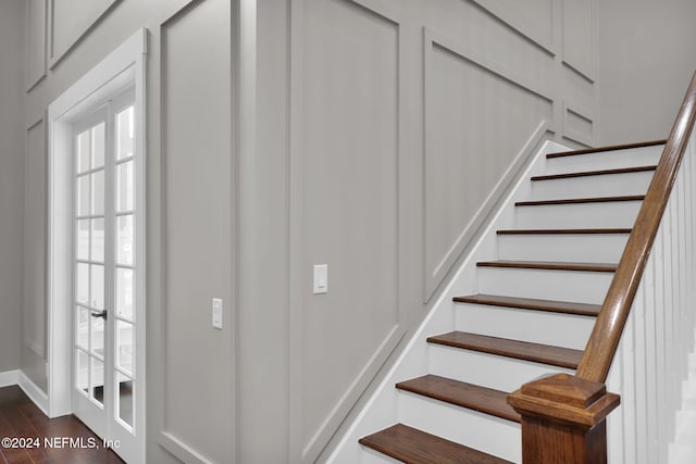 stairway featuring hardwood / wood-style flooring