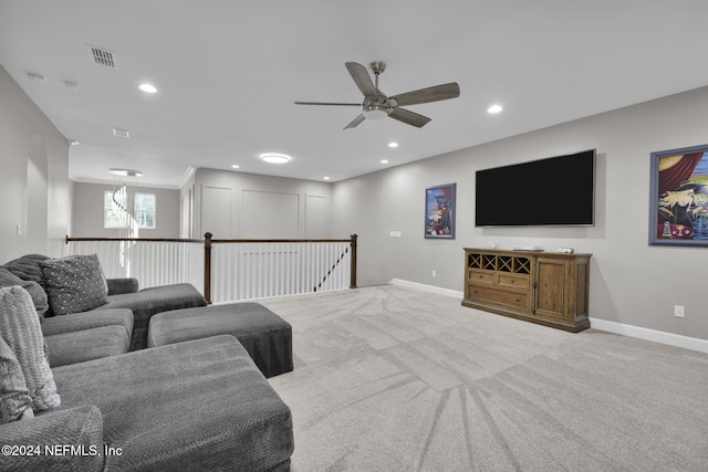 carpeted living room featuring ceiling fan