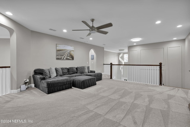 living room with ceiling fan and light carpet