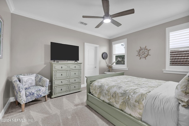 carpeted bedroom featuring ceiling fan and ornamental molding