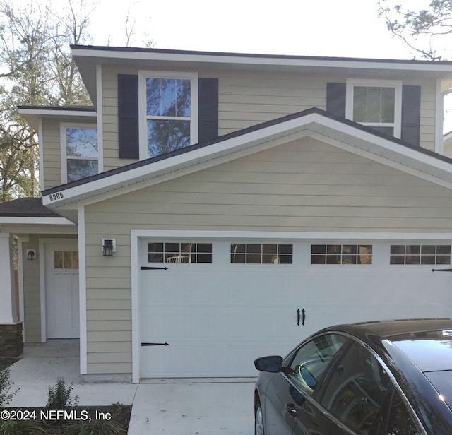 view of side of property with a garage