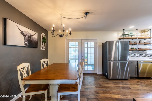 dining room featuring a chandelier, french doors, and dark hardwood / wood-style floors