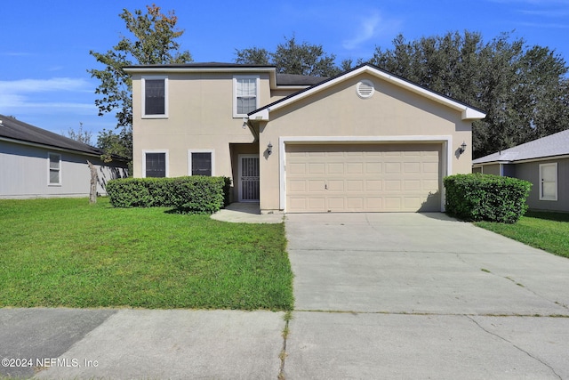 view of property with a front lawn and a garage