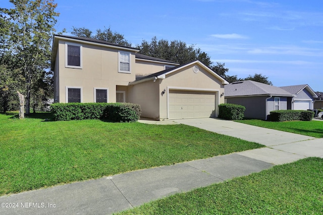 view of property featuring a garage and a front yard