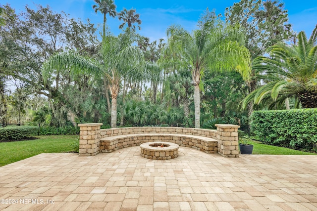 view of patio with an outdoor fire pit