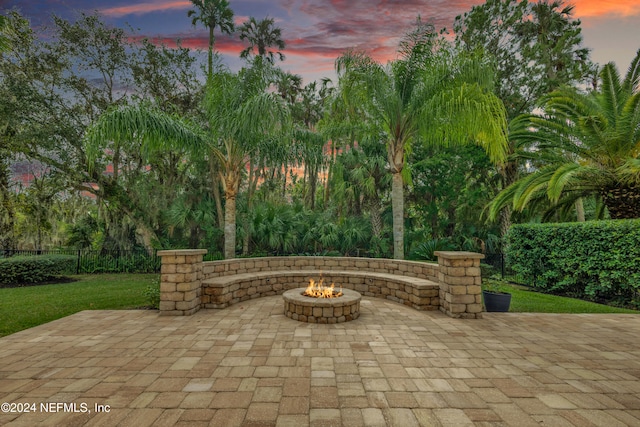 patio terrace at dusk with a fire pit