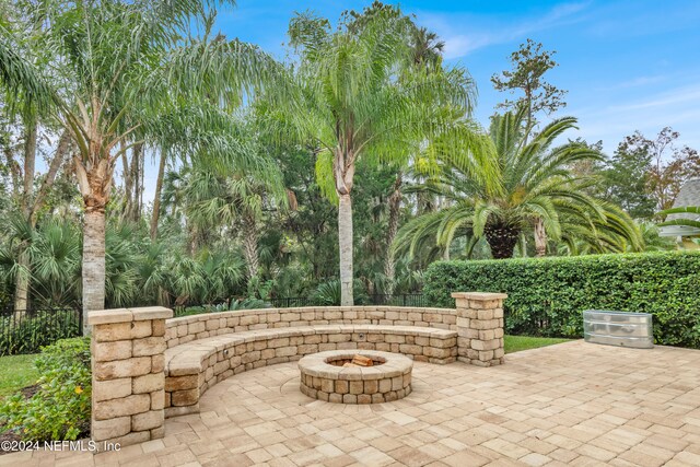 view of patio with a fire pit