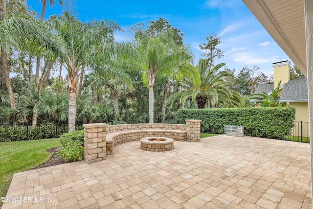 view of patio featuring an outdoor fire pit