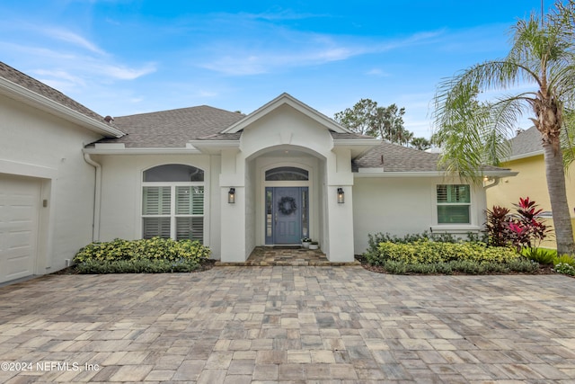 ranch-style house featuring a garage