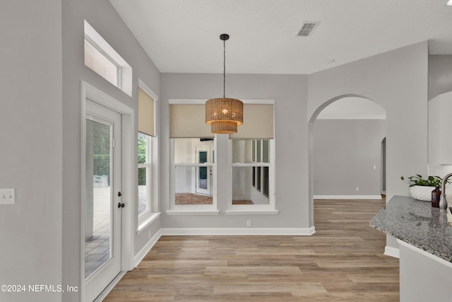 dining area featuring light wood-type flooring