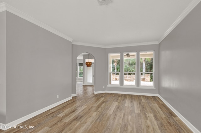 unfurnished room with light hardwood / wood-style flooring and ornamental molding