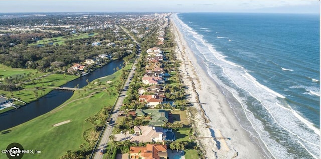 drone / aerial view featuring a view of the beach and a water view