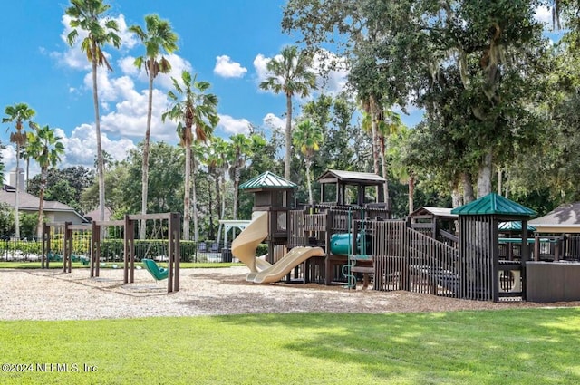 view of playground with a lawn