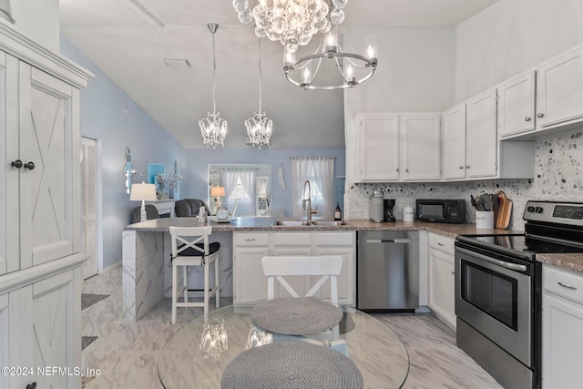 kitchen with sink, appliances with stainless steel finishes, and white cabinetry