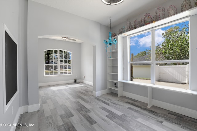 interior space featuring light wood-type flooring and ceiling fan