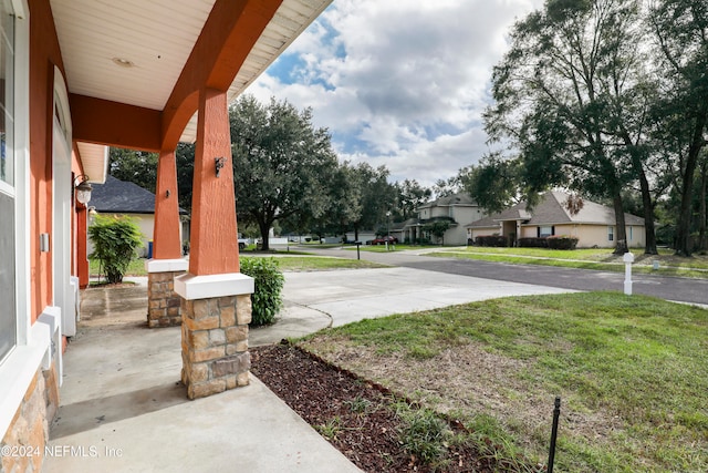 view of yard with covered porch