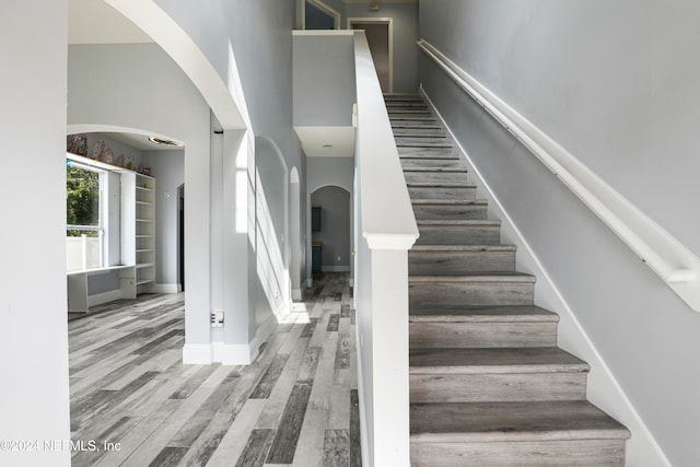 stairway featuring hardwood / wood-style floors