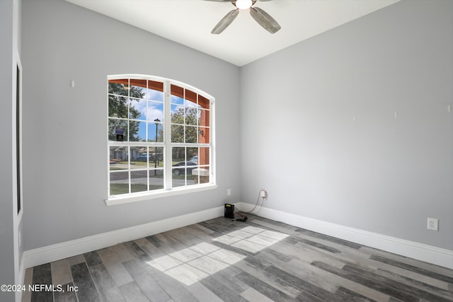 empty room featuring hardwood / wood-style floors and ceiling fan