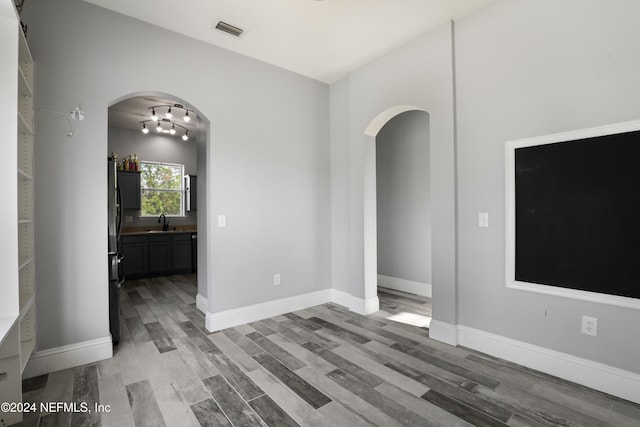 interior space featuring hardwood / wood-style flooring and sink