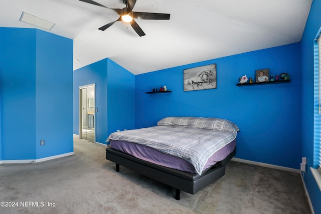 bedroom with carpet flooring, lofted ceiling, and ceiling fan