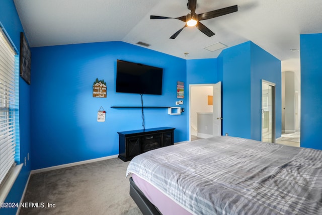 carpeted bedroom featuring vaulted ceiling and ceiling fan