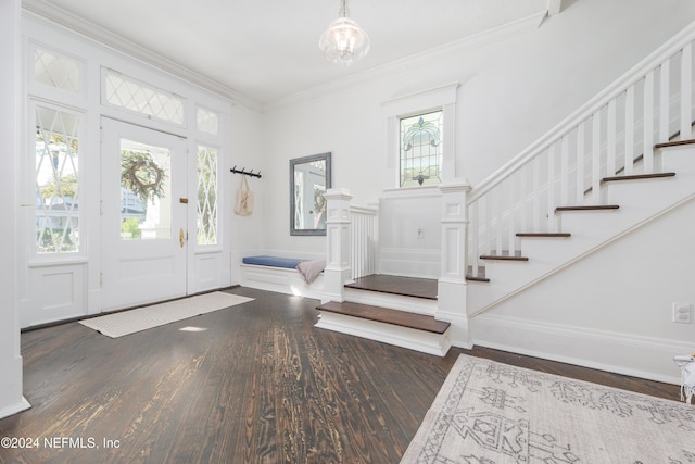 foyer with dark hardwood / wood-style floors and ornamental molding