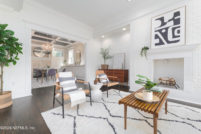 sitting room featuring beam ceiling, coffered ceiling, dark hardwood / wood-style flooring, a notable chandelier, and crown molding