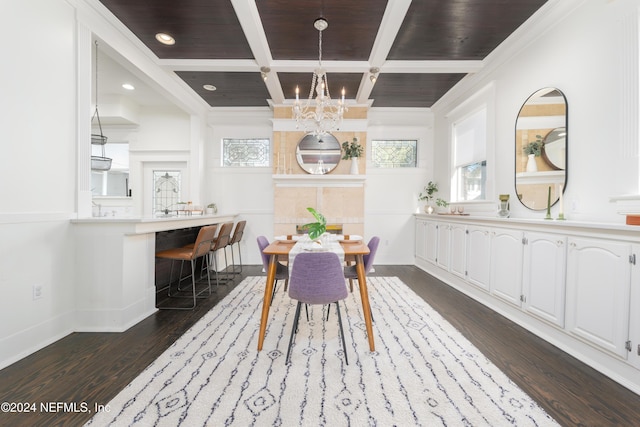 dining space with beam ceiling, coffered ceiling, dark hardwood / wood-style flooring, a chandelier, and ornamental molding