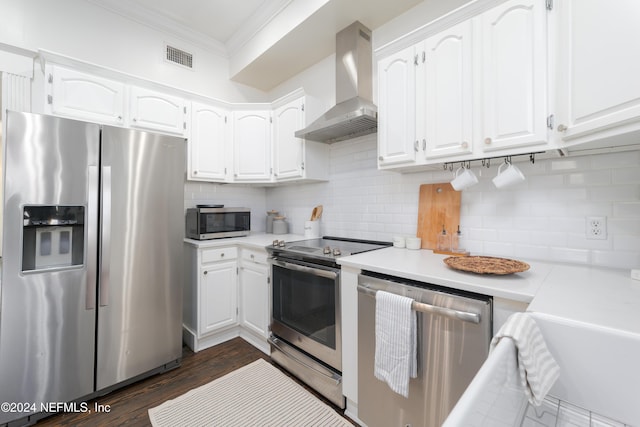 kitchen with white cabinets, stainless steel appliances, dark wood-type flooring, and wall chimney exhaust hood