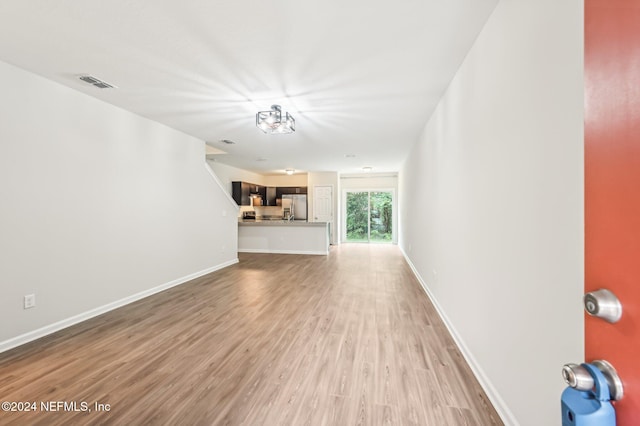 unfurnished living room featuring hardwood / wood-style floors