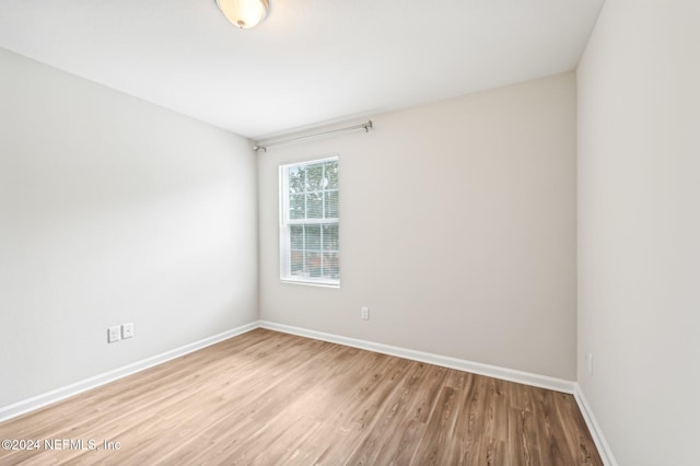 spare room featuring light hardwood / wood-style floors